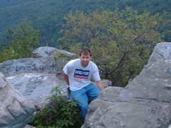 John climbing around the rocks below